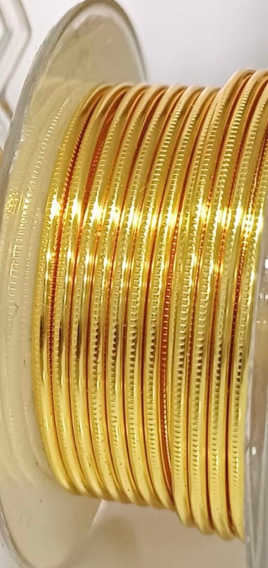Gold-colored textured round wire, Hammered and Nidus model. Collection 2024. Specially designed for wire wrapping.