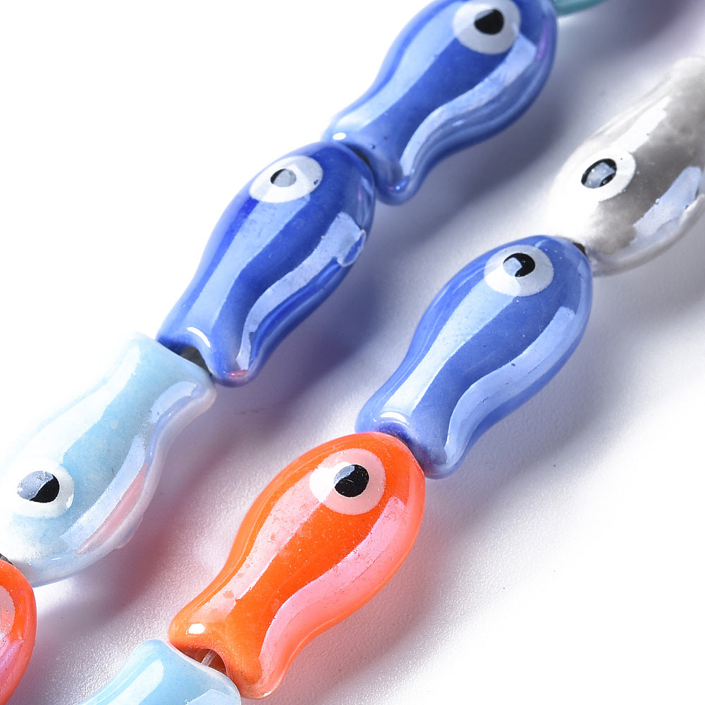 Fish-shaped glass beads, assorted colors.
