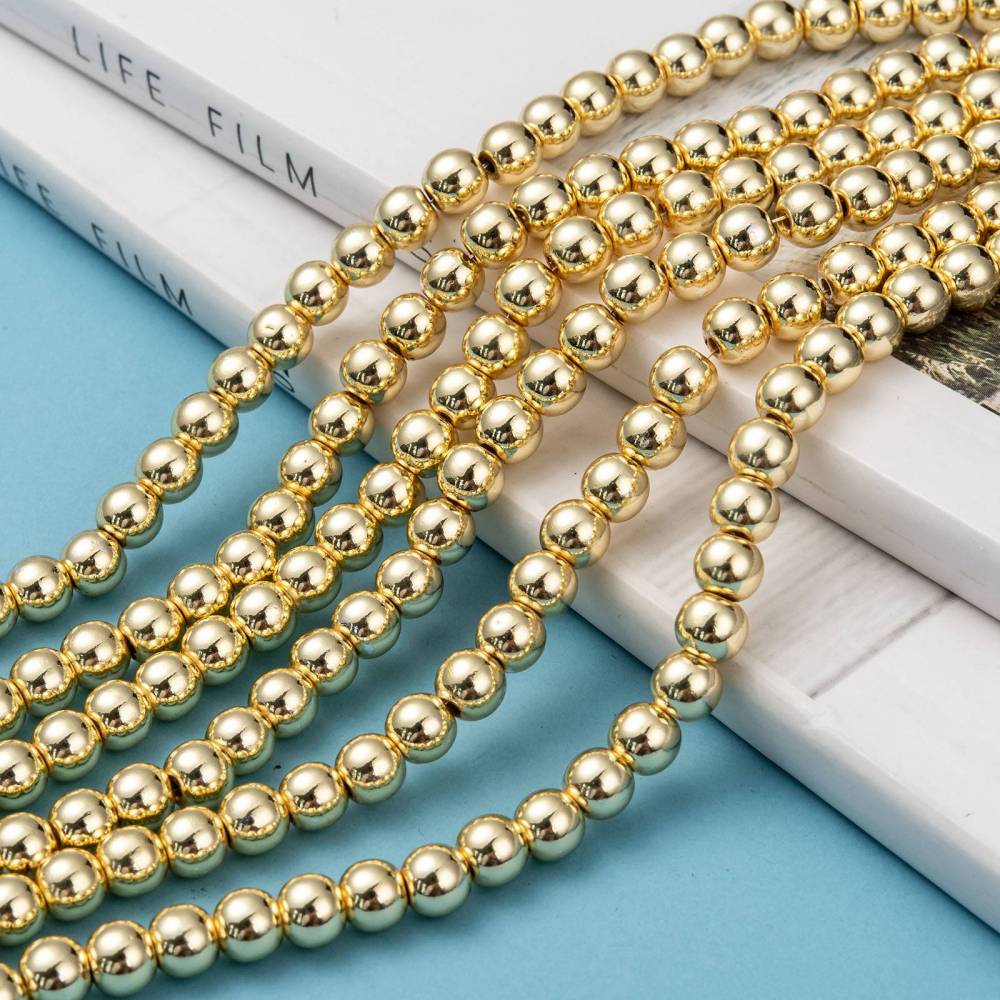 Hematite stones. Round, gold-plated. Various sizes.