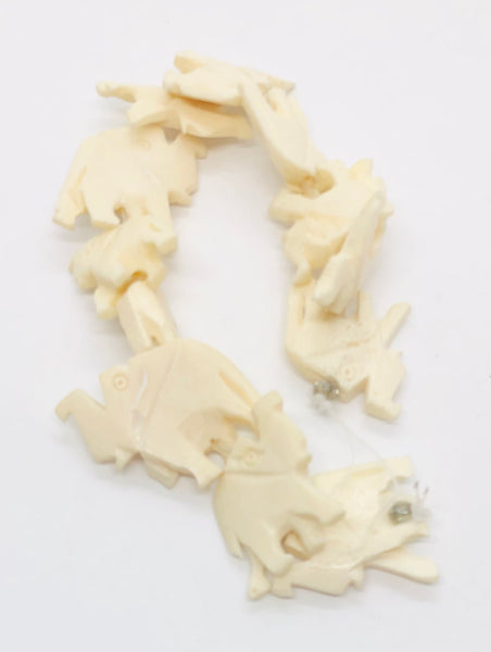 Pendant. Figure of Elephants in carved Synthetic bone from India