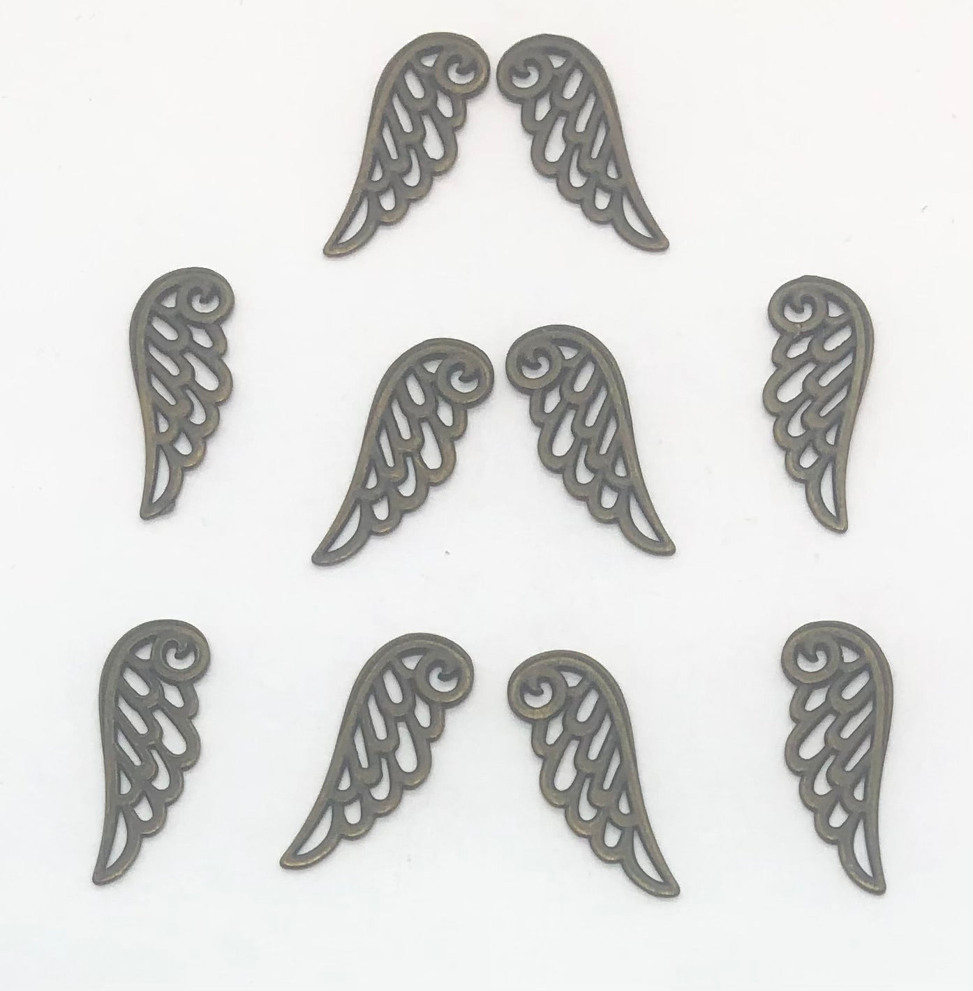 Metal half wing in bronze color