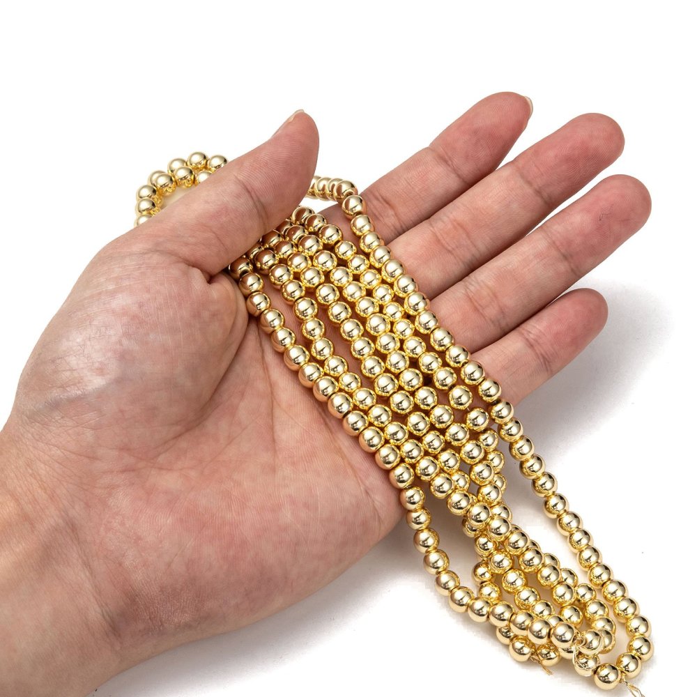 Hematite stones. Round, gold-plated. Various sizes.