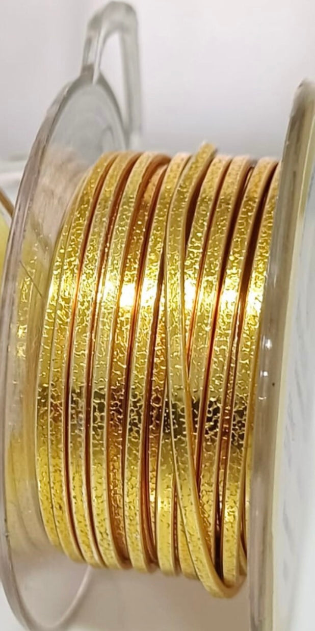 Gold-colored textured Flat wire, Hammered and Nidus model.  Collection 2024. Specially designed for wire wrapping.