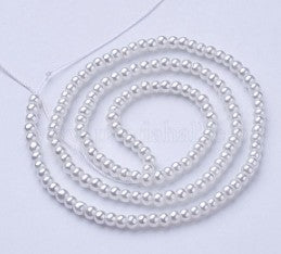 Hilos de perlas de cristal redondas color crema