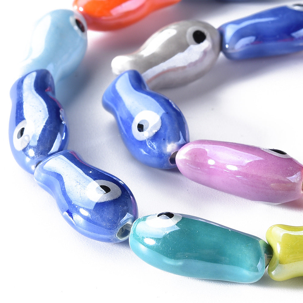 Fish-shaped glass beads, assorted colors.
